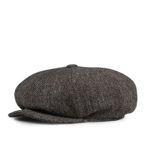 Brown wool tweed Baker Boy cap by Wigéns, featuring a classic herringbone pattern with a short brim and a round crown.