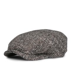 A side view of Wigéns' Brown Melange Wool Ivy Contemporary Cap, featuring a textured wool blend in gray and brown shades.