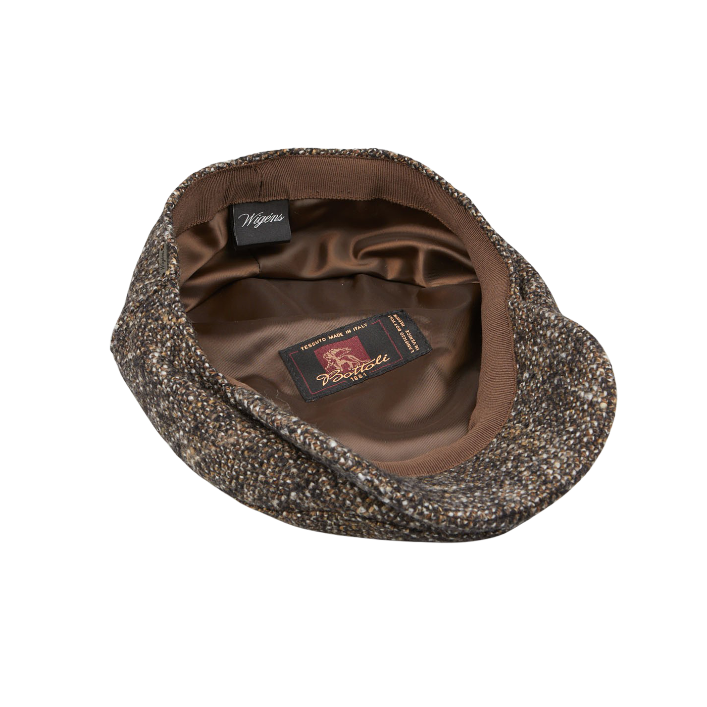 A Wigéns Brown Melange Wool Ivy Contemporary Cap with a label on it made of wool blend fabric.