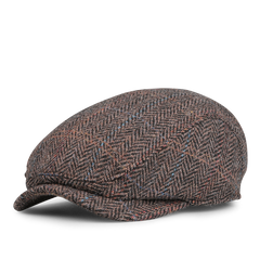 The Wigéns Dark Brown Ivy Contemporary Harris Tweed Cap is crafted from dark brown fabric with a herringbone pattern, featuring subtle blue and red accents against a white background.