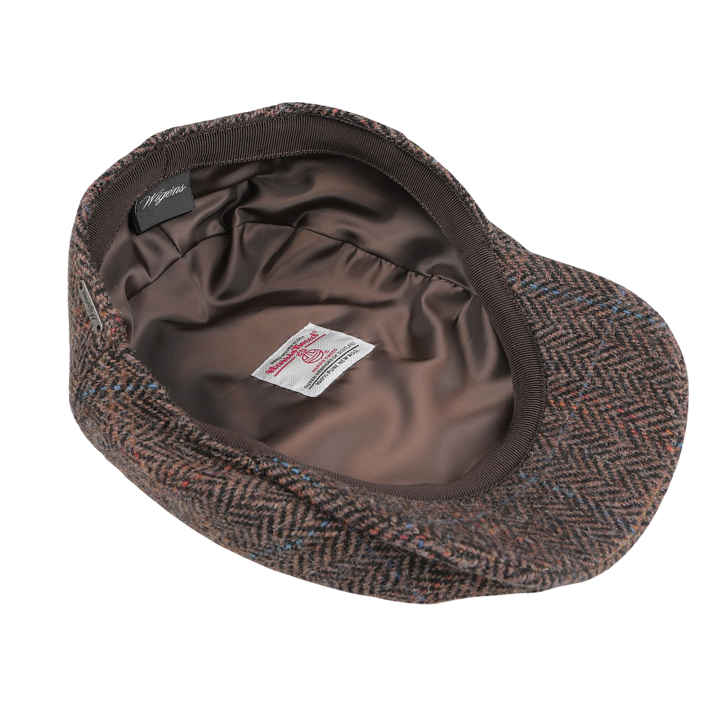 The Dark Brown Ivy Contemporary Harris Tweed Cap by Wigéns is skillfully turned inside out to showcase its opulent satin lining and distinguished labels, paying true homage to Harris Tweed craftsmanship.