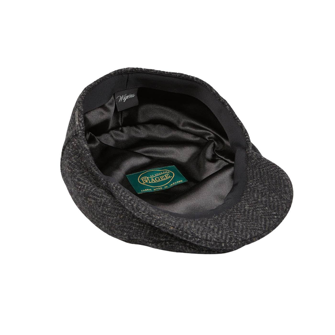 A black and green Wigéns cap with a label on it.