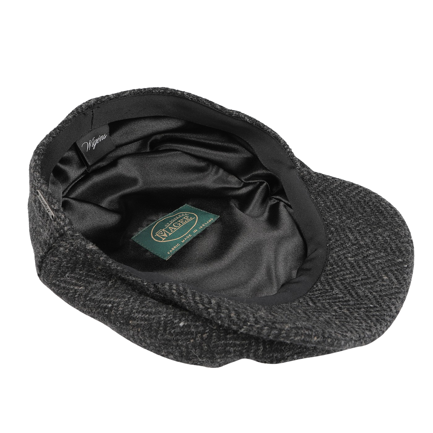 A Grey Herringbone Wool Tweed Baker Boy Cap from Wigéns highlights its interior lining with a green label sewn inside.