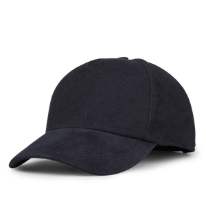 The Navy Blue Cotton Moleskin Baseball Cap by Wigéns stands out against the white background, adding a touch of classic style with its curved brim.