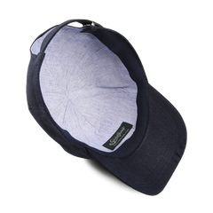 The Wigéns Navy Blue Linen Baseball Cap is displayed from above, showcasing its pure linen interior lining and an adjustable back strap.