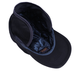 The Navy Loro Piana Cashmere Baseball Cap by Wigéns is pictured from above, showcasing its quilted lining, short brim, cashmere interior material, and meticulous stitching details.