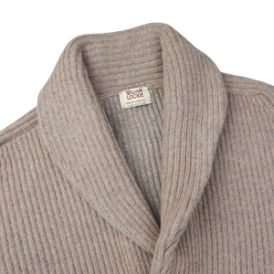 This image showcases a Beige Grey Plaited Lambswool Shawl Collar Cardigan sweater made by William Lockie, available in a flannel grey-mushroom beige color and finished with a William Lockie label.