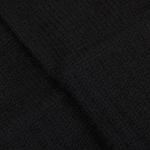 A close up image of a black William Lockie cashmere scarf.
