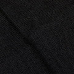 A close up image of a black William Lockie cashmere scarf.