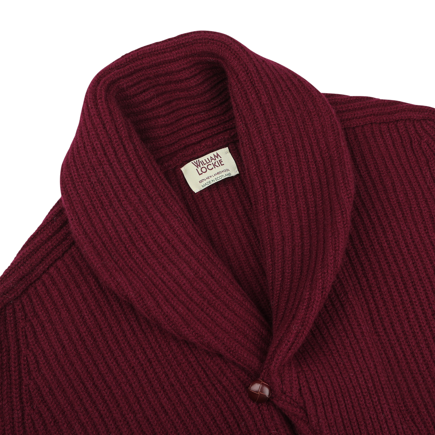 Close-up image of the Bordeaux Lambswool Shawl Collar Cardigan by William Lockie, featuring deep burgundy ribbed lambswool, a shawl collar, and a single visible leather button.