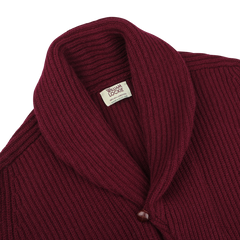 Close-up image of the Bordeaux Lambswool Shawl Collar Cardigan by William Lockie, featuring deep burgundy ribbed lambswool, a shawl collar, and a single visible leather button.