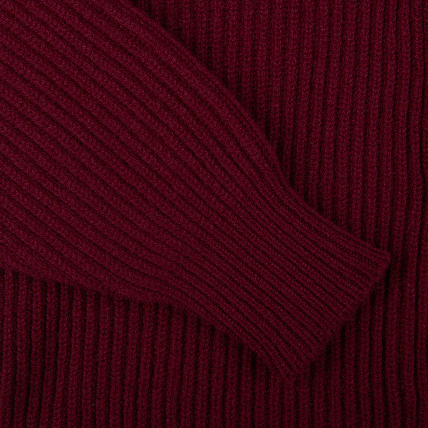 A close up of a William Lockie Bordeaux Lambswool Shawl Collar Cardigan.