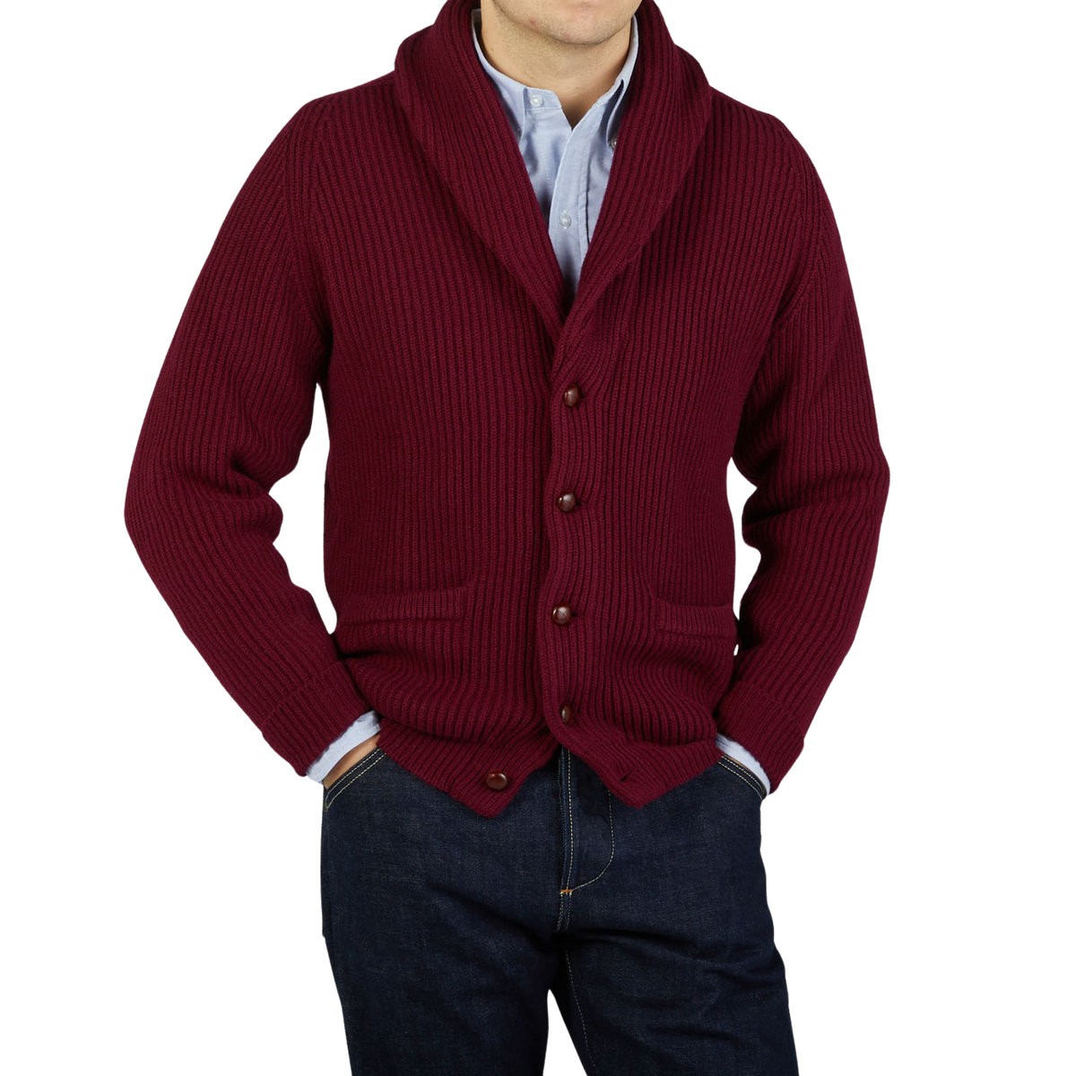 A man wearing a Bordeaux Lambswool Shawl Collar Cardigan by William Lockie and jeans.