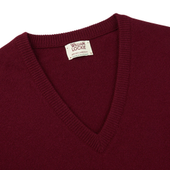 The William Lockie Bordeaux V-Neck Lambswool Sweater.