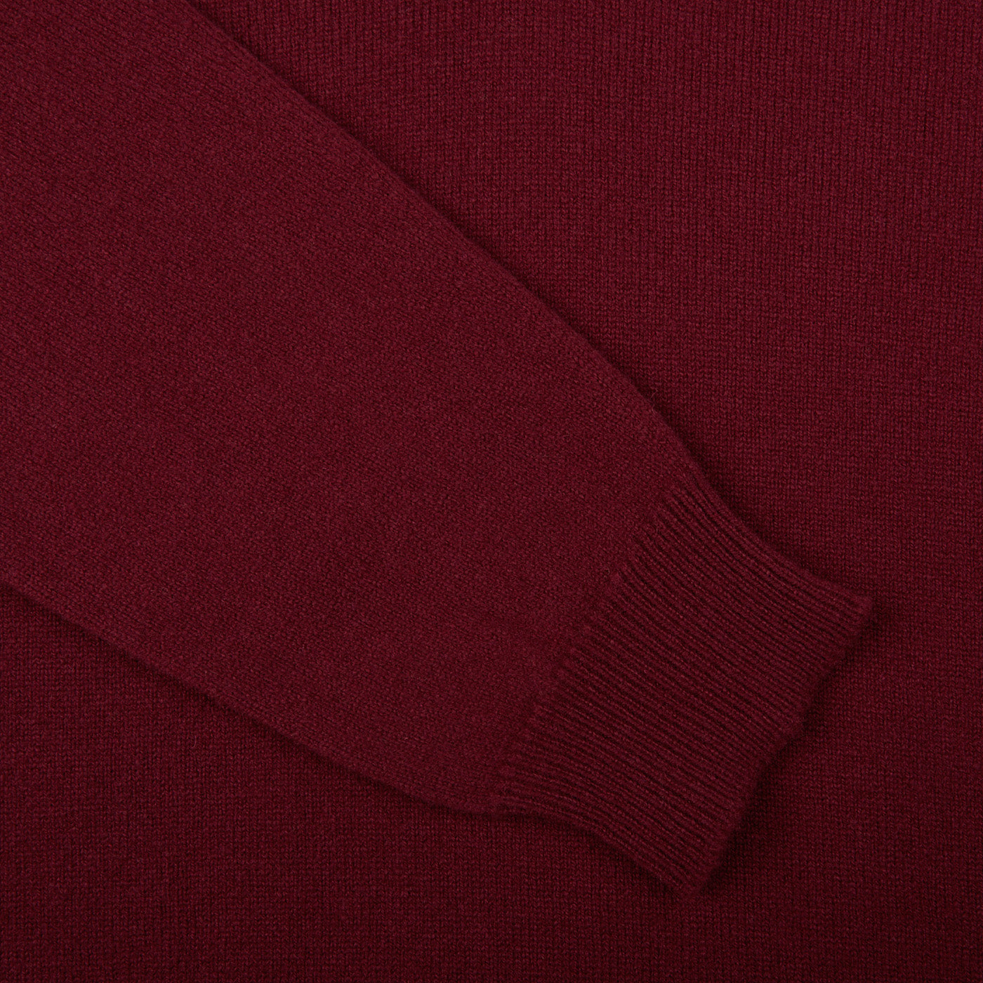 A close up of a William Lockie Bordeaux V-Neck Lambswool Sweater.