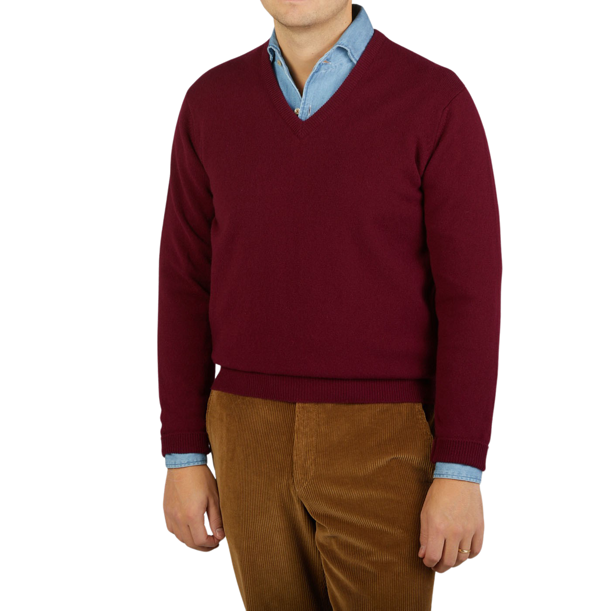 A man wearing a comfy Bordeaux V-Neck Lambswool sweater by William Lockie.