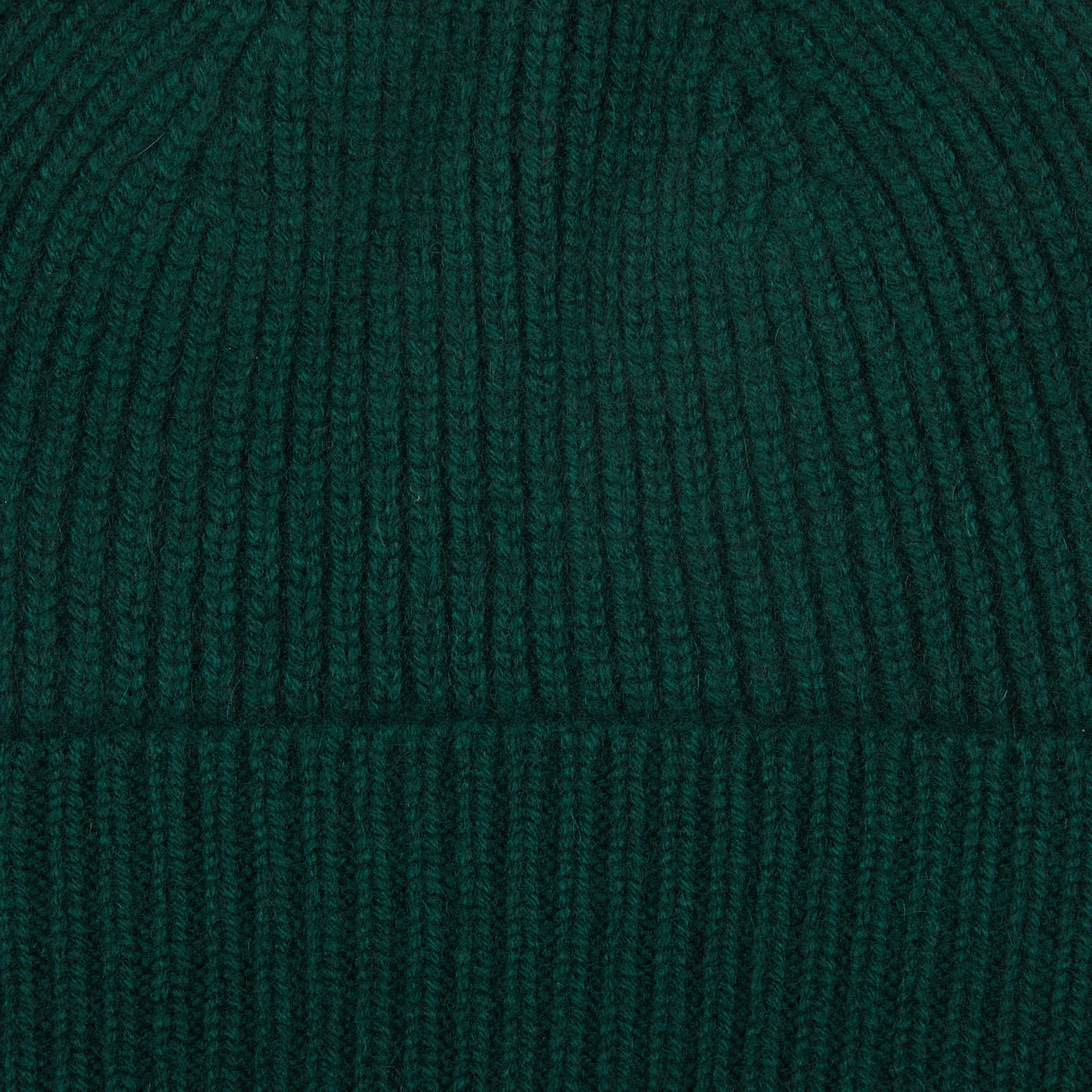 A warm Bottle Green Cashmere Fine Ribbed Beanie by William Lockie on a white background.