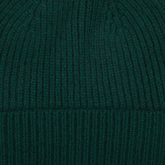 A warm Bottle Green Cashmere Fine Ribbed Beanie by William Lockie on a white background.