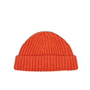 A Burnt Orange Cashmere Ribbed Short Beanie by William Lockie on a white background.