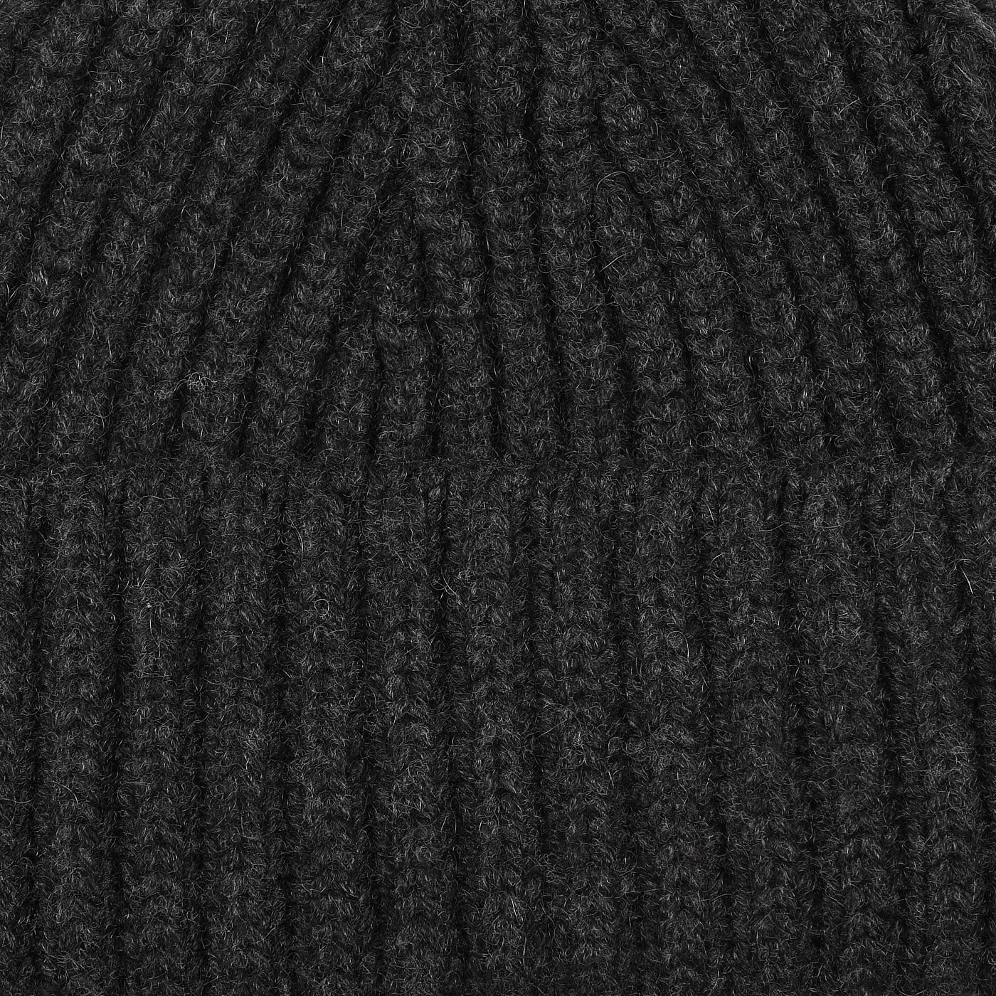 Close-up image of the William Lockie Charcoal Grey Cashmere Ribbed Short Beanie, crafted from luxurious cashmere.