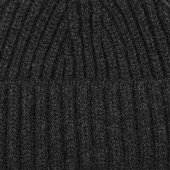 Close-up image of the William Lockie Charcoal Grey Cashmere Ribbed Short Beanie, crafted from luxurious cashmere.