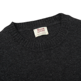 A William Lockie Charcoal Grey Crew Neck Lambswool Sweater, with a label on it.