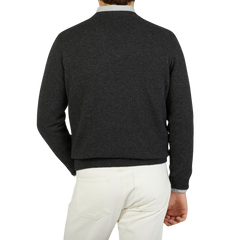 The back view of a man wearing a William Lockie Charcoal Grey V-neck Lambswool Sweater.