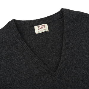 The William Lockie men's Charcoal Grey V-neck Lambswool Sweater in grey knitwear.