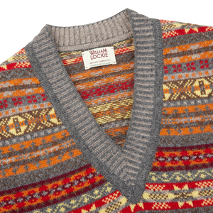A William Lockie Fairisle sweater with a red, orange and yellow pattern.