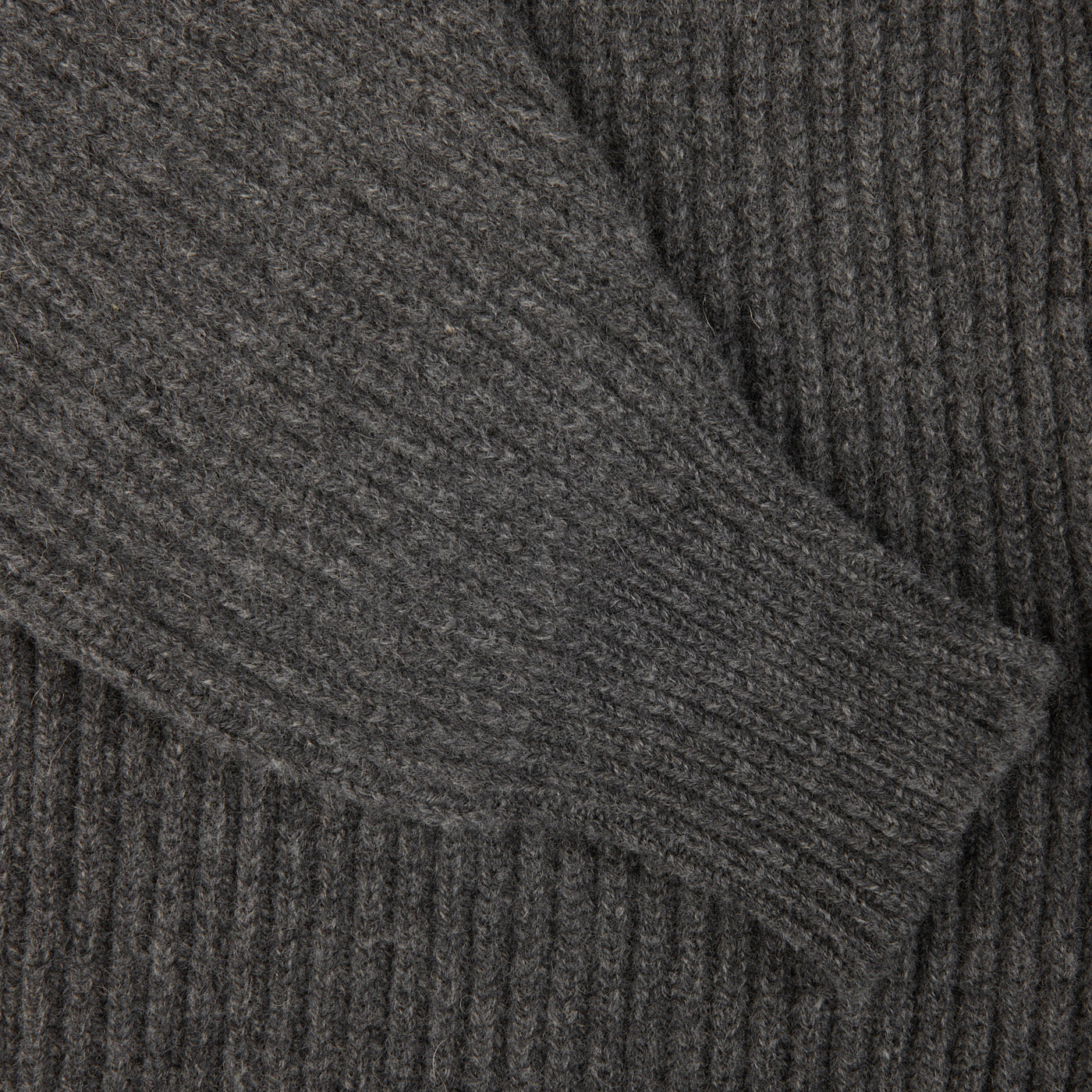 A close up of a Cliff Grey Lambswool Shawl Collar Cardigan made from Scottish lambswool, featuring leather buttons by William Lockie.