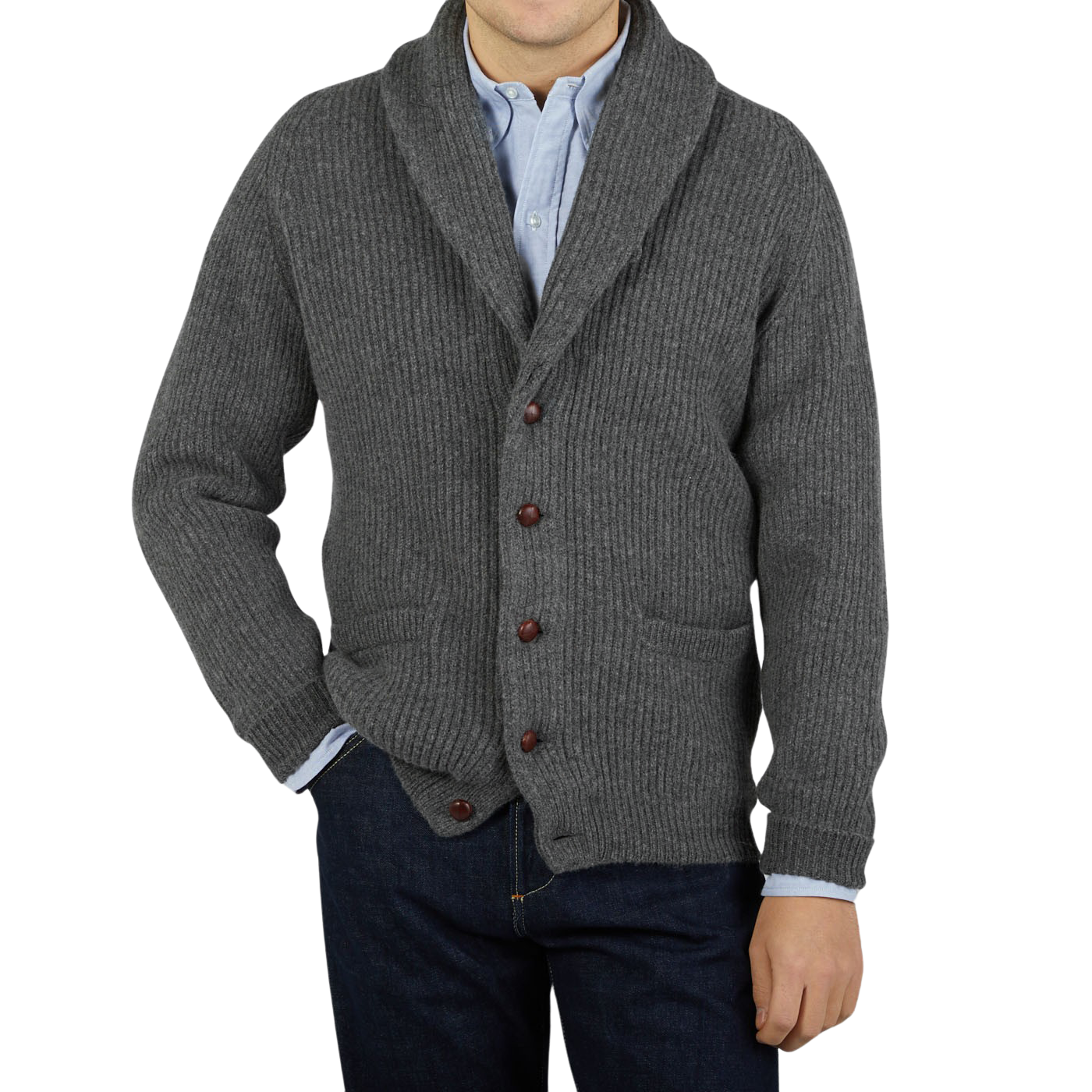 A man wearing a William Lockie Cliff Grey Lambswool Shawl Collar Cardigan with leather buttons and jeans.