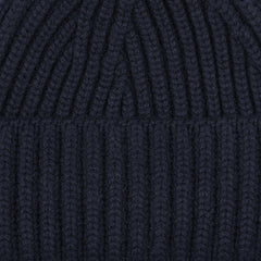 A close-up of the luxurious Dark Navy Cashmere Short Ribbed Beanie by William Lockie.