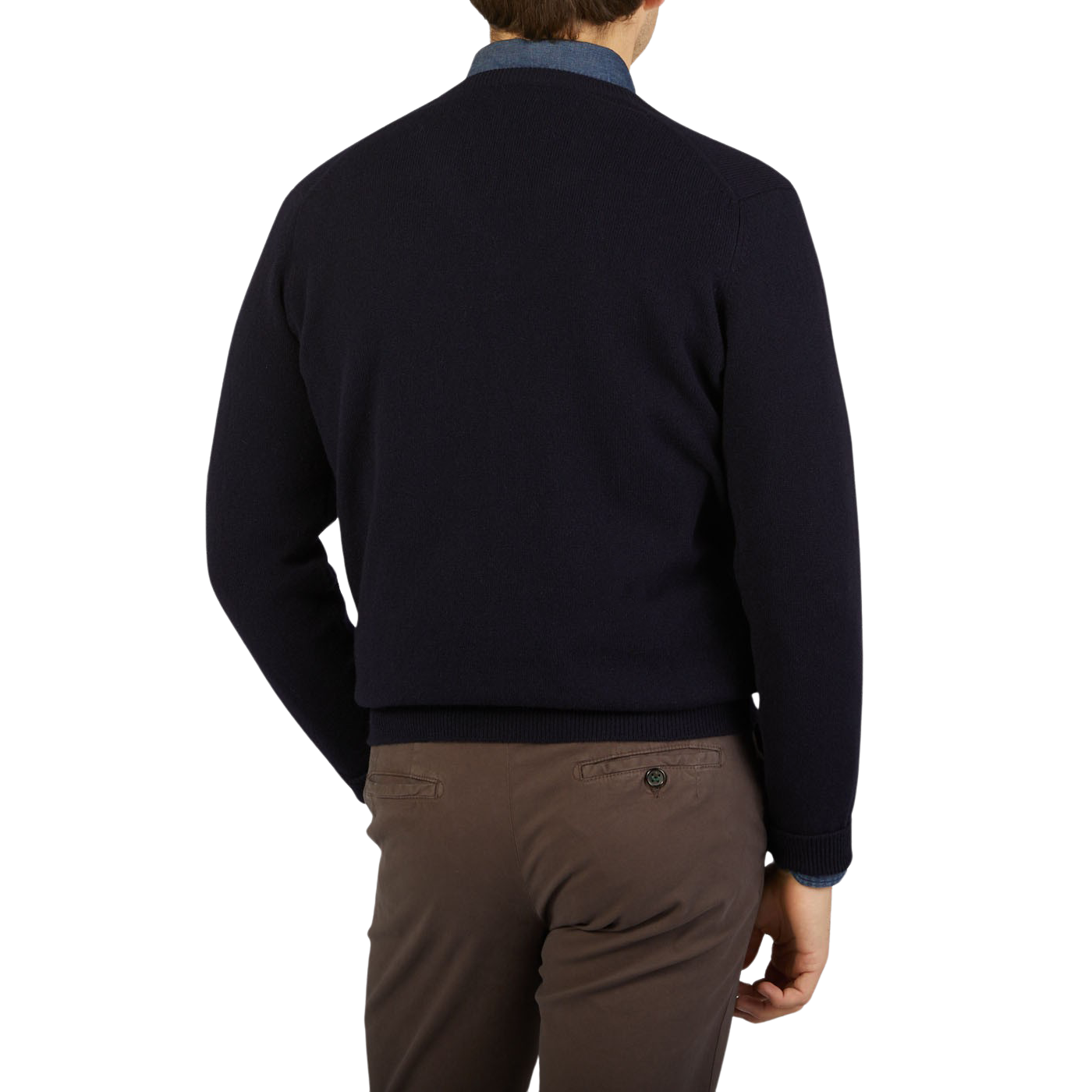 The back view of a man wearing a cozy William Lockie Dark Navy V-Neck Lambswool Sweater.