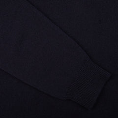 A close up of a William Lockie Dark Navy V-Neck Lambswool Sweater.