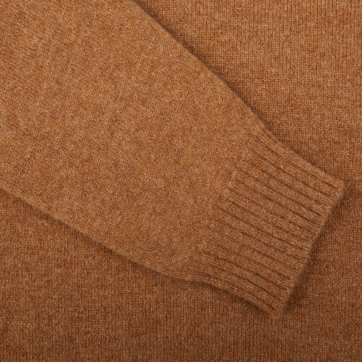 A comfortable close up of a William Lockie Driftwood Crew Neck Lambswool Sweater.