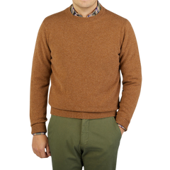 A man wearing a Driftwood Crew Neck Lambswool Sweater crafted by William Lockie.