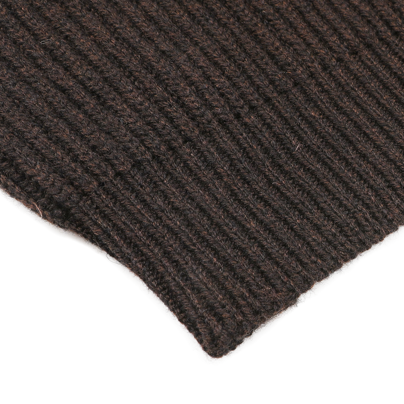 Close-up of a dark brown ribbed knitted fabric, reminiscent of a William Lockie Ebony Brown Lambswool Shawl Collar Cardigan.