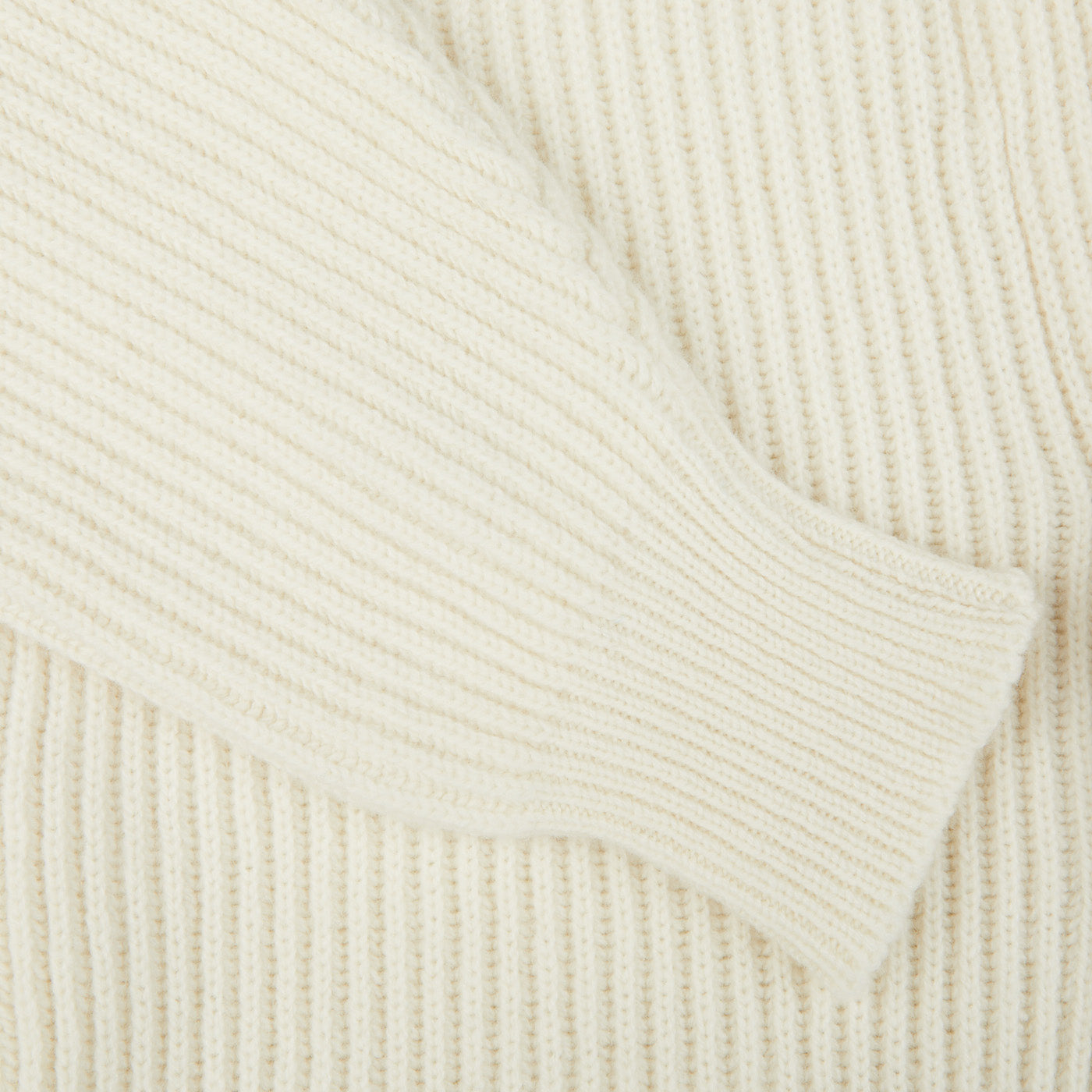 A close up of an Ecru Beige Lambswool Shawl Collar Cardigan made with Scottish lambswool, by William Lockie.