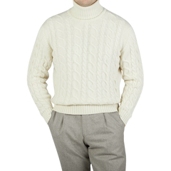 William Lockie, a man wearing an Ecru Cable Knit Pure Cashmere Rollneck sweater made by William Lockie.