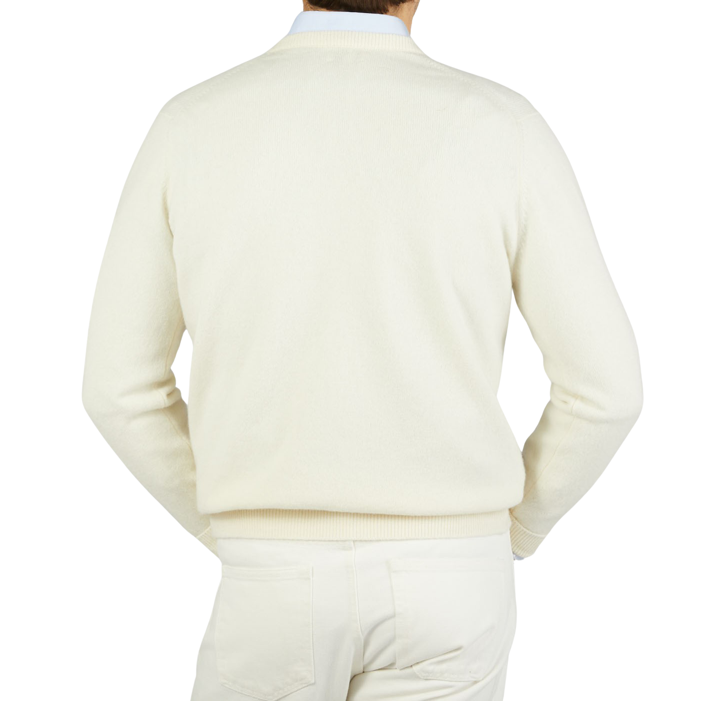 The back view of a man wearing a William Lockie Ecru White Lambswool V-Neck Sweater, creating a smart casual look.