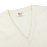 An Ecru White Lambswool V-Neck Sweater by William Lockie on a white background, creating a smart casual look.