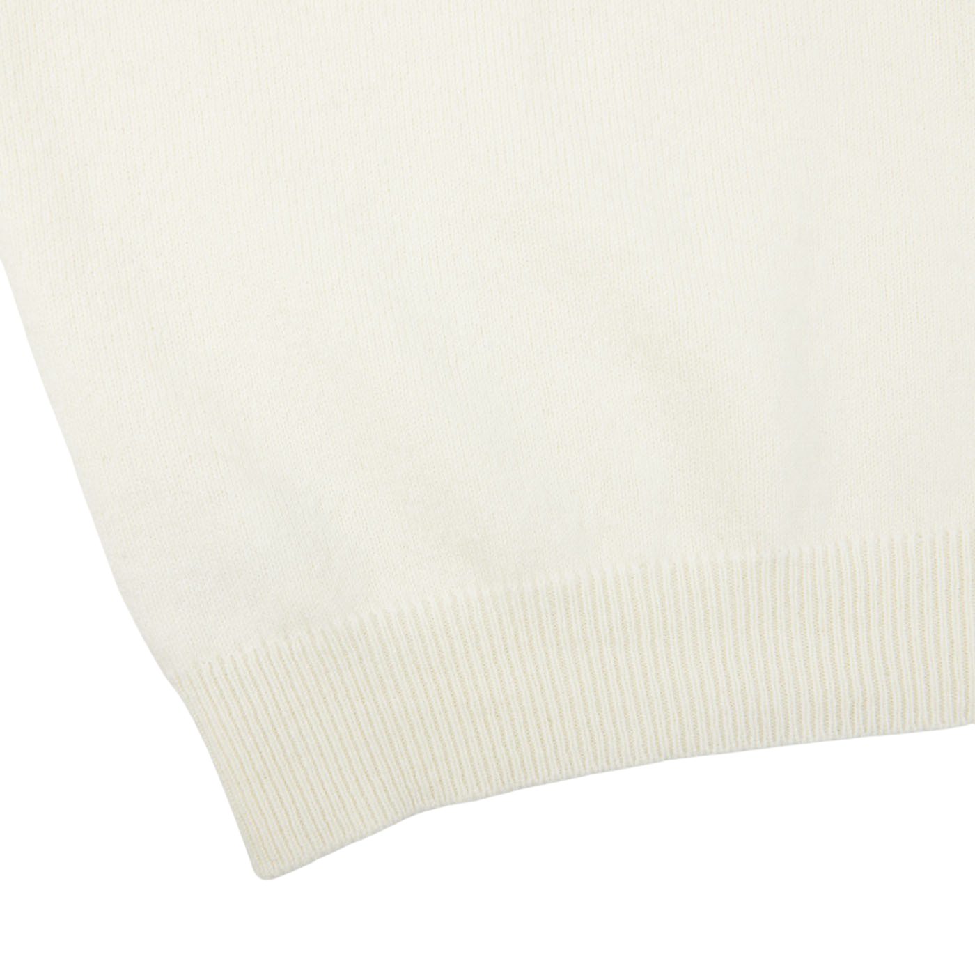 A close up of a William Lockie Ecru White Lambswool V-Neck Sweater on a white surface.