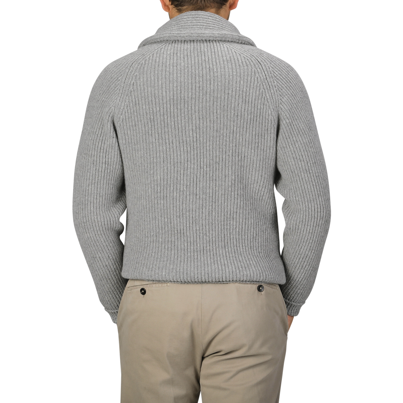 Rear view of a person wearing the Flannel Grey Lambswool Shawl Collar Cardigan by William Lockie, paired with beige pants.