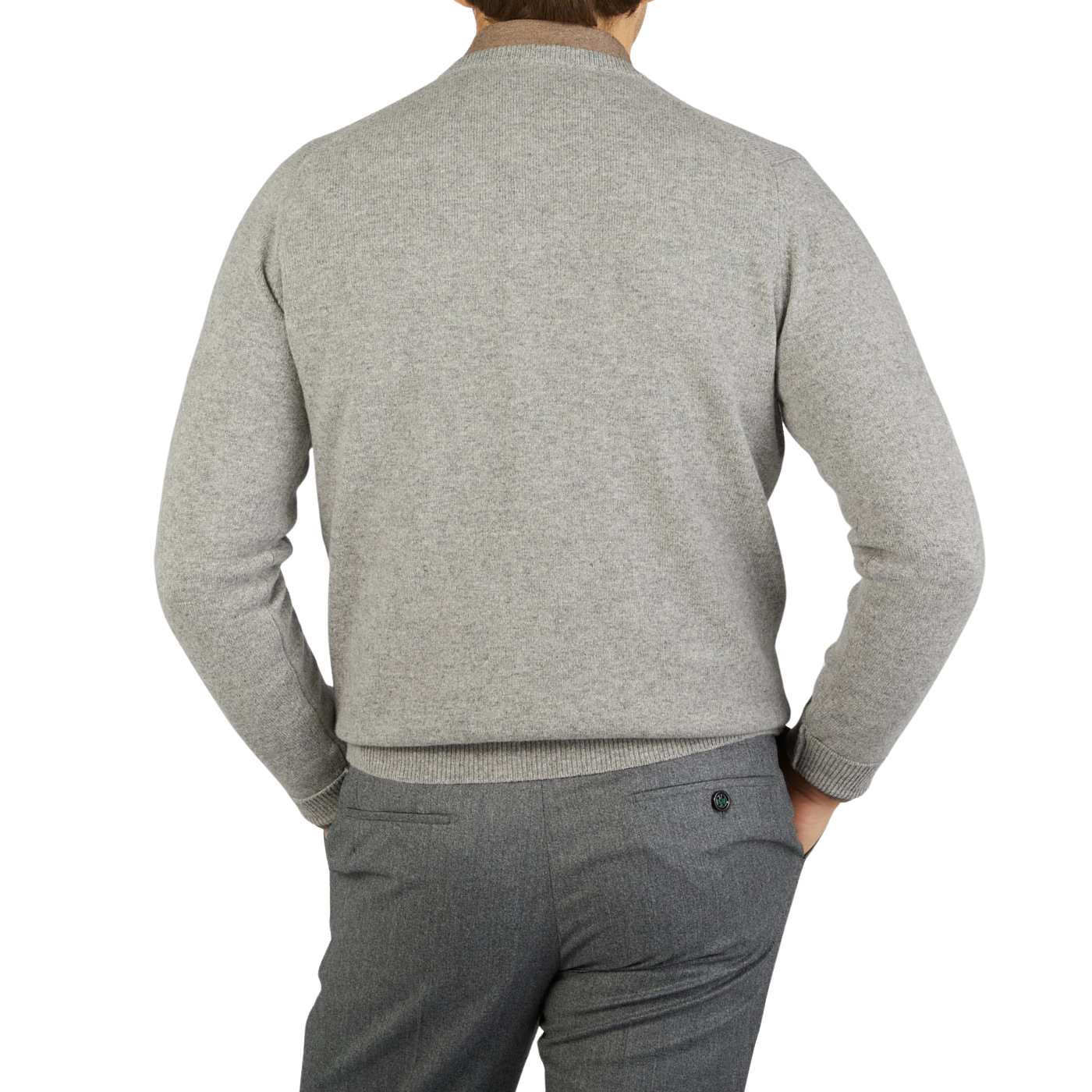 The back view of a man wearing a William Lockie Flannel Grey V-Neck Lambswool Sweater and pants.