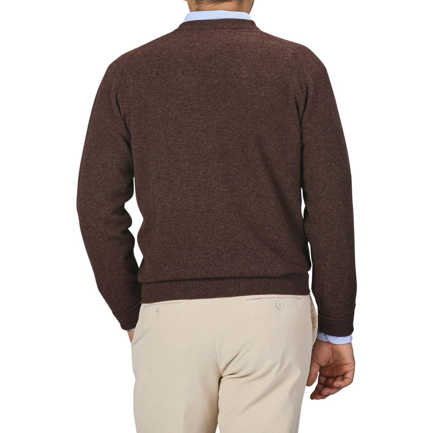 A person wearing a Hickory Brown Deep V-Neck Lambswool Sweater by William Lockie and beige pants is shown from the back in this image.