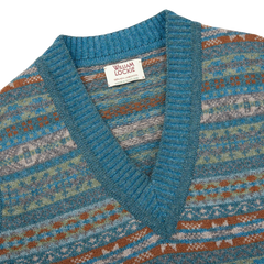 The William Lockie Hunter Blue Fair Isle V-Neck Lambswool Slipover, made of Scottish lambswool, features a blue and brown Fairisle pattern.