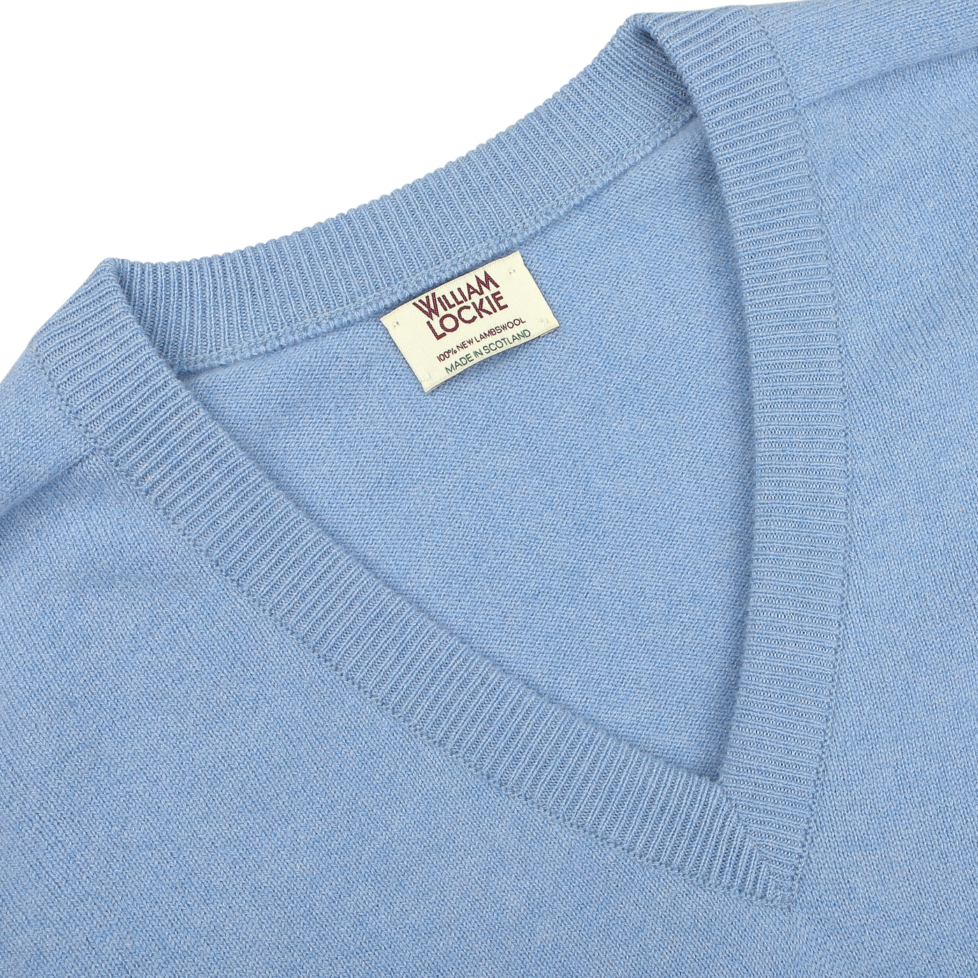 Close-up of an Iceberg Blue Deep V-Neck Lambswool Sweater with a visible label that reads "William Lockie.