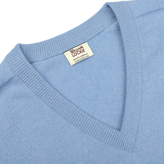 Close-up of an Iceberg Blue Deep V-Neck Lambswool Sweater with a visible label that reads "William Lockie.