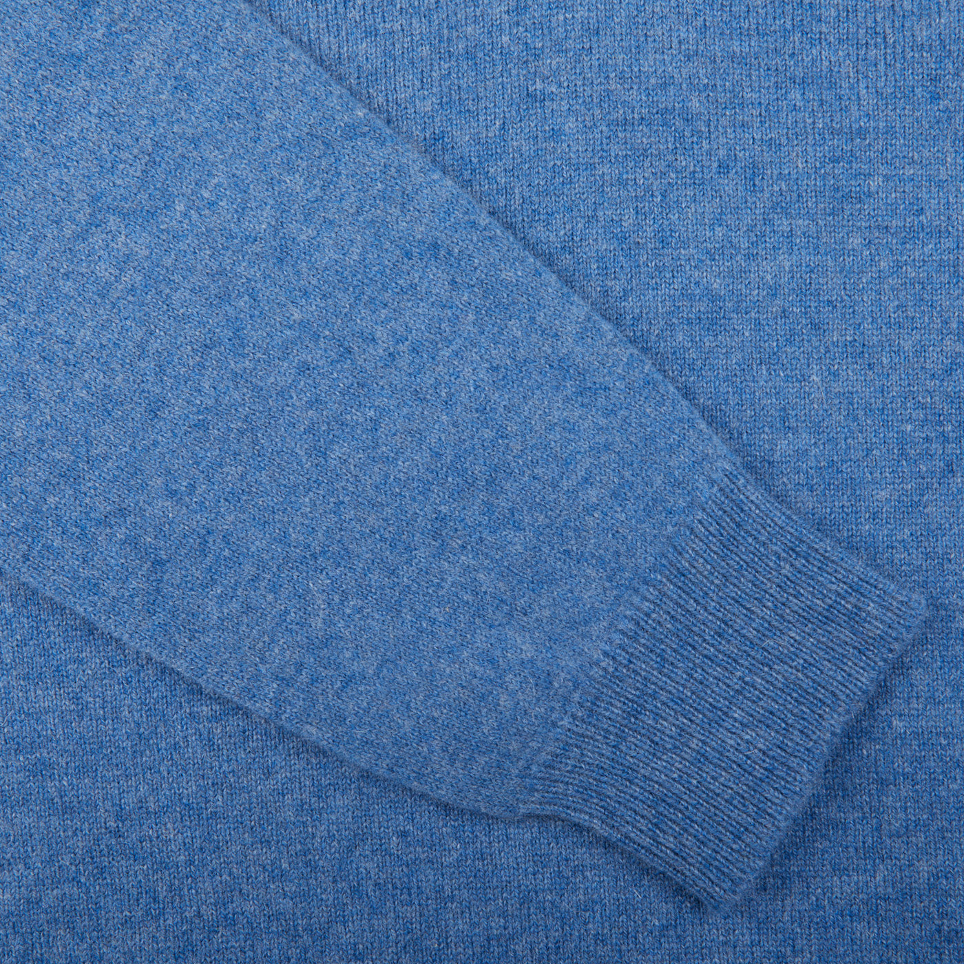 A close up of a William Lockie Jeans Blue Lambswool V-Neck Sweater.