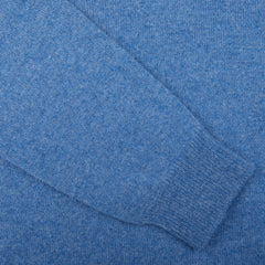 A close up of a William Lockie Jeans Blue Lambswool V-Neck Sweater.